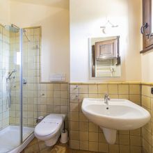 Rustic bathroom with traditional stone walls and natural materials