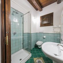 Rustic bathroom with traditional stone walls and natural materials