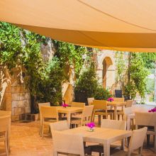 Homemade Sicilian dishes served on the outdoor seaview terrace of our agriturismo
