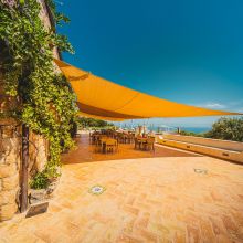 Traditional Sicilian dining room with rustic furnishings and a stunning seaview
