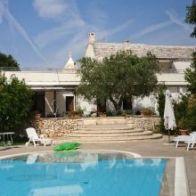 Infinity pool and traditional masseria in the Puglia countryside