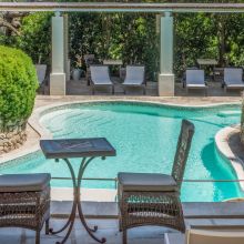 Swimming pool set in a green Mediterranean garden in Puglia