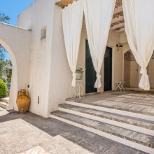 Common area by the pool at the Salento Charme Apartments