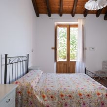 Double bedroom with traditional furnishings in a restored Sicilian country farmhouse Double bedroom with traditional furnishings in a restored Sicilian country farmhouse