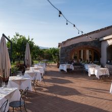 Lunch in the shade, Sicily all around Rustic dining room at a countryside hotel serving dinner in eastern Sicily