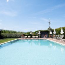 A dip in the Mediterranean way of life Family swimming pool in the garden of a countryside hotel near the Sicilian coast