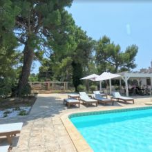 Slow afternoons beside the water Poolside relaxation area at a holiday residence near Gallipoli in southern Apulia
