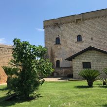 Traditional Salento masseria surrounded by Mediterranean vegetation