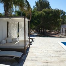 Nothing on the agenda but sunshine and a little well-earned rest Sun loungers beside the swimming pool at an Apulian country hotel