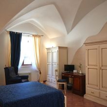 Superior room, soft linens, natural textures and the promise of a peaceful night Superior bedroom with natural stone details in an Apulian farmhouse