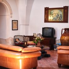 A welcoming place to settle in and feel at home Country-style living room with traditional furnishings in a Puglian holiday property