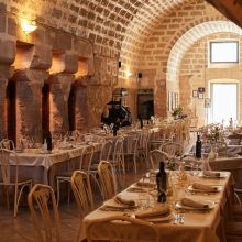 Where the warmth of a country home meets the pleasure of good food Restaurant dining room in a traditional Apulian masseria with rustic stone interiors