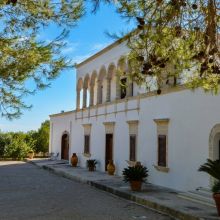 Where the timeless beauty of the Apulian countryside unfolds Traditional Apulian masseria surrounded by vineyards and Mediterranean countryside