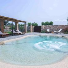 Peaceful poolside relaxation area Peaceful poolside relaxation area at masseria Ostuni
