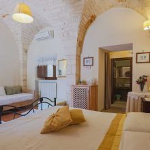 A triple room, the charm of a country house Interior of a triple room at the masseria Ostuni