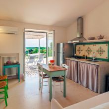 The living room and the kitchen of the 38 m2 1 bedroom apartment, Puglia is present in every detail Otranto Alimini the living room and the kitchen of the 38 m2 1 bedroom apartment