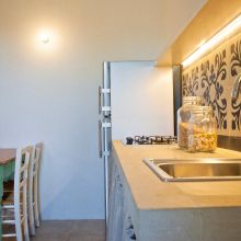 The kitchen of the 60 m2 2 bedroom apartment, designed with simple Apulian style Otranto Alimini the kitchen of the 2 bedroom apartment 80m2