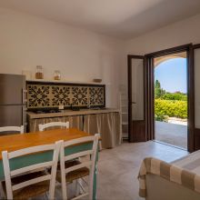The living room and the kitchen of the 60 m2 2 bedroom apartment, Inspired by the simple elegance of traditional Puglian design Otranto Alimini the kitchen and living room of the 2 bedroom apartment 60m2