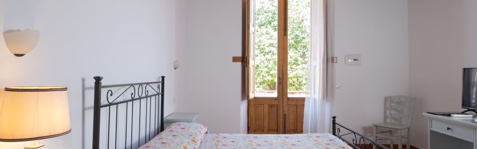 Double bedroom with traditional furnishings in a restored Sicilian country farmhouse Double bedroom with traditional furnishings in a restored Sicilian country farmhouse