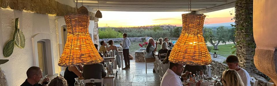 Outdoor dining area at a historic masseria in the Apulian countryside